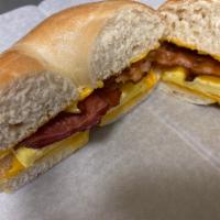 Bagel Breakfast Sandwich with Meat · 2 scrambled eggs, ham sausage or bacon, American cheese on a bagel.