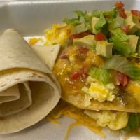 Stacked Breakfast Enchiladas  · 2 corn tortillas stacked with eggs, cheddar cheese, onion, choice of meat, smothered in gree...