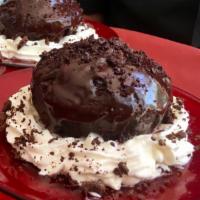 Big Warm Chocolate Cupcake · Dark chocolate cupcake served warm and drenched in bittersweet chocolate ganache. Decorated ...