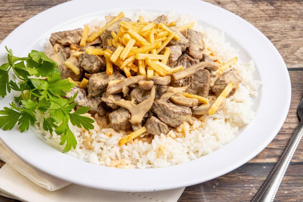 Beef Strogonoff · Sauteed beef in light cream sauce, served with rice and french fries.