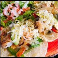 Morrabay Tacos · Protein: Marinated grilled shrimp. Toppings: A melody of grilled veggies like green and red ...