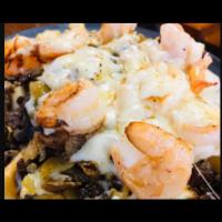 Earthquake Fries Plate · Protein: Marinated grilled shrimp with seasoned sliced steak served over rigged fries. Toppi...