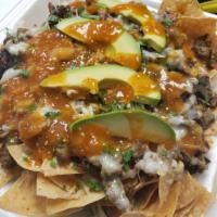 Loaded Nachos Plate · Protein: Your choice of seasoned steak, chicken or alpastor. Toppings: Fresh tomato, cilantr...