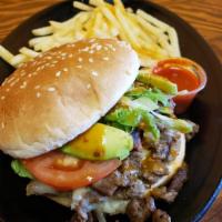 The Mexican Burger · Protein: Your choice of seasoned steak, chicken or alpastor. Toppings: Freshly chopped lettu...