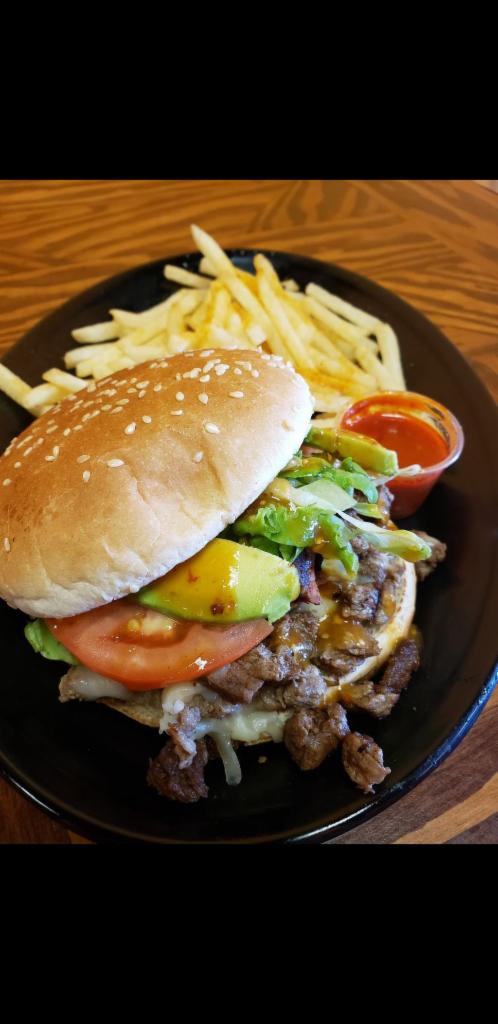 The Mexican Burger · Protein: Your choice of seasoned steak, chicken or alpastor. Toppings: Freshly chopped lettuce, tomato, avocado, dressed with mayonnaise, ketchup and salsa. Sides: Includes thinly sliced seasoned fries and a small drink.