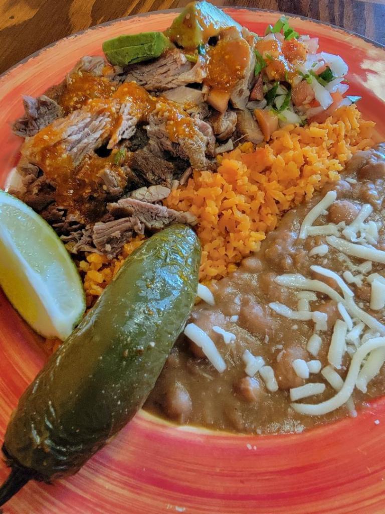 Carnitas Plate  · Pieces of pork carnitas sautéed until lighted browned and complemented with pico de gallo . Served with rice and beans .  