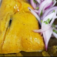 Pork Tamal  · Steamed corn masa filled with pork & black olive wrapped in banana leaves.  Served with sals...