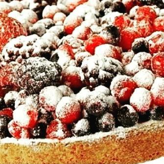 Mixed-Berry Tart · Shortcrust pastry base filled with pastry cream, topped with a layer of sponge cake & lavishly garnished with an assortment of blackberries, raspberries, red currants and strawberries. 