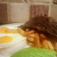Skirt steak a Lo Pobre · 8 oz. Grass feed Skirt Steak, served with Jasmine rice, 2 fried eggs,  French fries & sweet ...