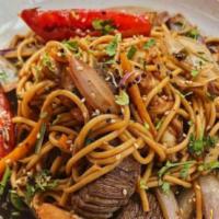 Tallarin Saltado Carne (skirt Steak) · Skirt steak strips sauteed with onions & tomatoes marinated in soy sauce, cilantro over pasta.