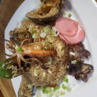 Chaufa de Mariscos (Seafood Fried Rice) · Mussels, calamari, clams, shrimps mixed with Jasmine rice, eggs, scallions, peppers, soy sau...