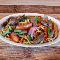 Tallarin Saltado Limeno · Noodles in a lima style sauteed stek or chicken, cooked in wok with onions and tomatoes. Opt...