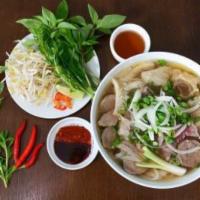 V1. Pho Dac Biet · Special noodle soup, rare steak, brisket, meatball, tripe and tendon
