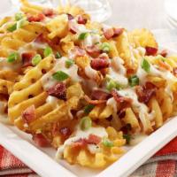 Loaded Fries · 3 chef’s cheese blend, pico de gallo, pickled jalapenos, smoked crispy bacon.
