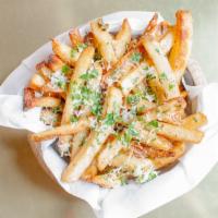 Truffle Fries · Ultimate crispy fries tossed with truffle oil, 5 months aged parmesan cheese, parsley.