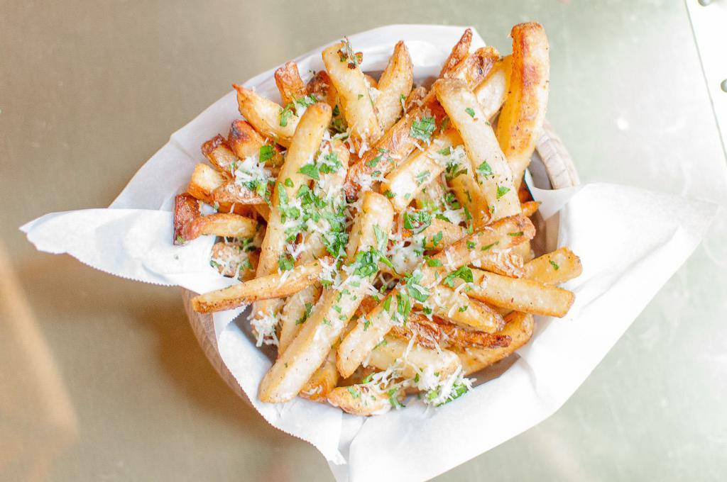 Truffle Fries · Ultimate crispy fries tossed with truffle oil, 5 months aged Parmesan cheese, parsley.