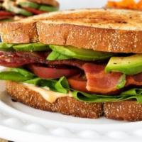 BLTA Sandwich · Smoked slab bacon, lettuce, tomato, avocado, pickles, chipotle aioli. Choice of ultimate cri...