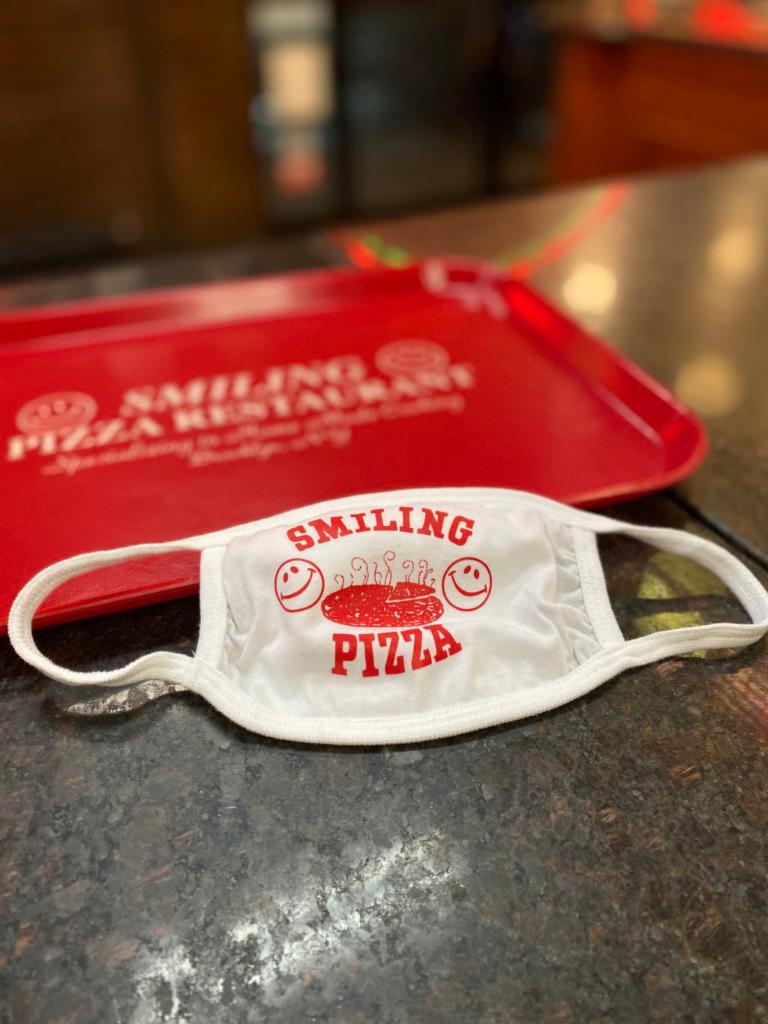 Face Covering · White Smiling Pizza Face Covering - White With Red Lettering (one size fits all adult cotton washable)