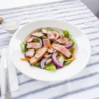 Ahi Tuna Salad · Marinated ahi tuna steak grilled and served over mixed greens with mango vinaigrette. Temper...