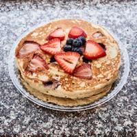 Wild Pancake · Three buttermilk pancakes loaded with your choice of blueberry, strawberry, coconut or banana.