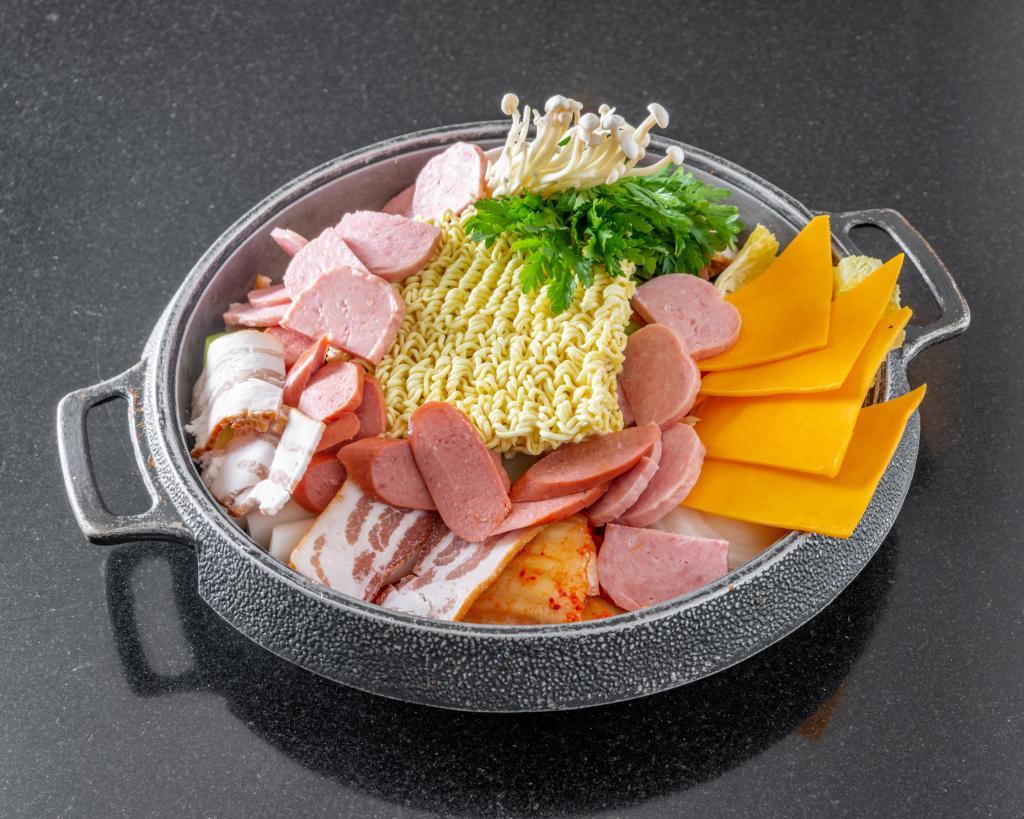 Ham n Sausage hot pot · Assorted sausages, ham, vegetables and instant ramen noodles in a special hot pot. Spicy.