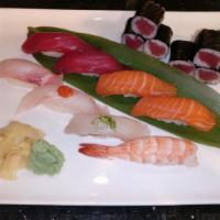 Sushi Regular · 8 pieces of sushi with 1 Tuna roll. Served with soup or salad.