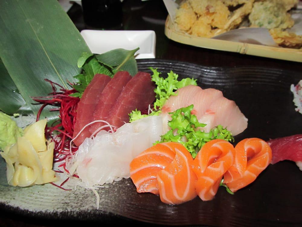Sushi and Sashimi Combo · 6 pieces sushi and 10 pieces sashimi with 1 California roll. Served with soup and salad.