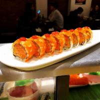 Volcano Roll · 8 pieces. Spicy tuna, spicy salmon, spicy yellowtail inside, tobiko and spicy sauce on top.