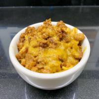 Chopped Meatless Mac and Cheese Bowl · Mac and cheese topped with Italian chopped meatless, sauteed peppers and onions with a drizz...