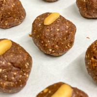 Chocolate Peanut Butter Energy Bites · Made with organic dates, organic peanut butter, organic cacao. 