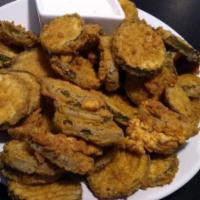 Crispy Fried Pickles · Kosher dill pickle chips breaded and deep-fried. Served with chipotle ranch.