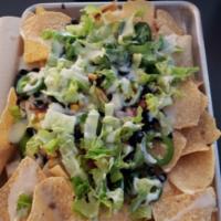 Cowboy Nachos · Deep-fried tortilla chips, queso, cheese blend, pico de gallo, corn, black beans, jalapenos,...