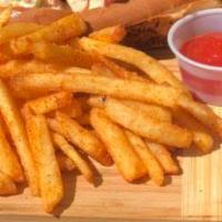Seasoned Truffle Fries · Fries tossed in white truffle oil seasoned with pink salt and house made BBQ rub.