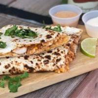 Cheese Quesadilla · Toasted flour tortilla filled with a melted four-cheese blend with sides of citrus crema & p...