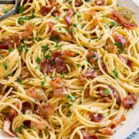 Pasta Carbonara · Cream sauce with bacon bits, ham, mushroom and pecorino 