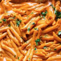 Penne alla Vodka · Penne pasta in our in house made by the order vodka sauce baked with mozerella cheese (side ...