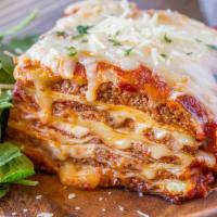 Lasagna Parmigiana · Homemade meat lasagna made in store from scratch with marinara sauce baked with mozzarella c...