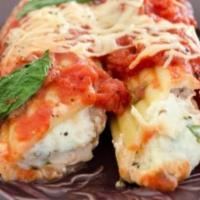Cheese Manicotti Parmigiana · Cheese filled manicotti with pur famous marinara sauce baked with mozerella cheese (Side of ...