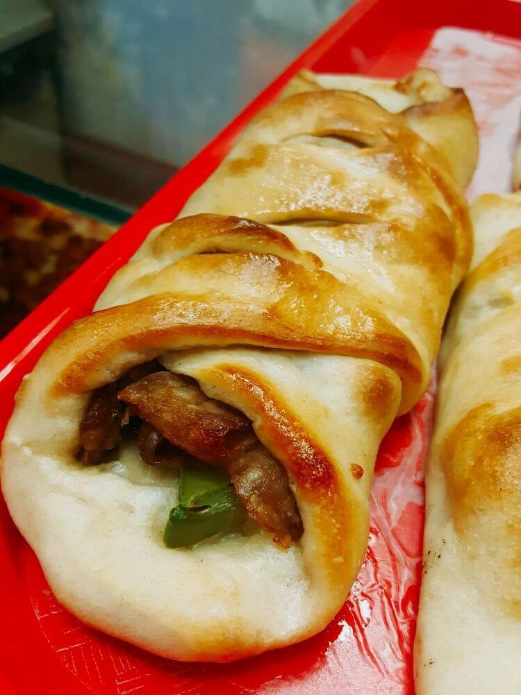 Sausage Roll · Italian link sausage with peppers, onions and mozzarella cheese rolled up and baked