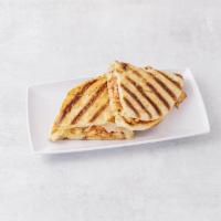 32. Italiano Panini · Grilled chicken, roasted red peppers, oregano, mozzarella cheese and tomatoes.