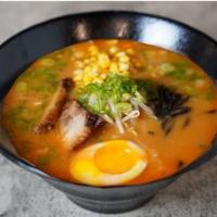 23. Tan Tan Miso Ramen · Our home-made spicy miso base chicken broth served with pork/chicken chashu, bean sprouts, s...