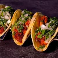Mini Taco Trio (3) · Corn Tortillas with Choice of Meat,Onions,Cilantro and Our Home Made Green/Red Sauce