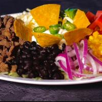 Taco Salad · Your Choice of Meat On a Bed of 
Lettuce, Tomato,Red Onions,Avocado,
Corn,Black Beans,Topped...