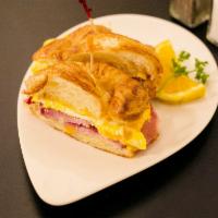 Croissant Sandwich Breakfast (Ends at 2:30pm) · French Croissant, honey ham, 2 eggs and cheddar cheese. With a side of potatoes.