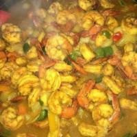 Tropical Curried Coconut Shrimp · Shrimp sauteed with peppers and onions, cooked in coconut milk