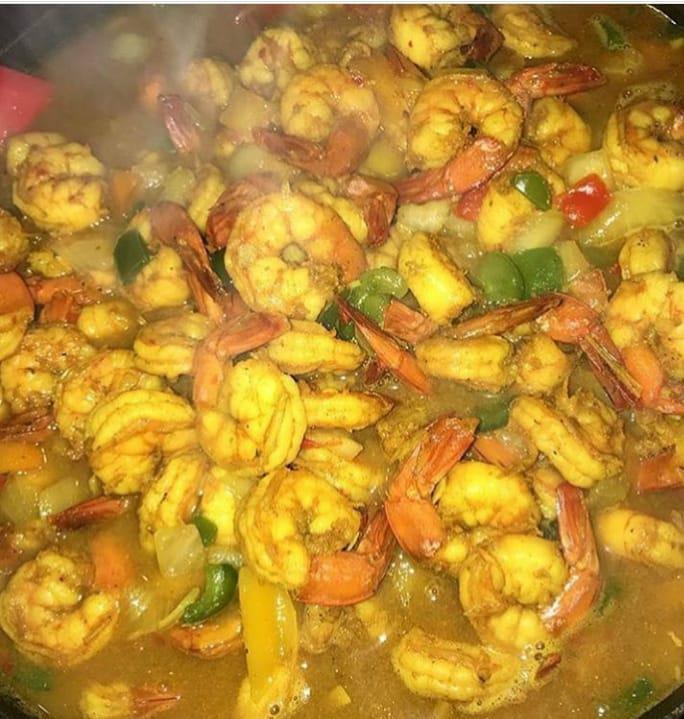 Tropical Curried Coconut Shrimp · Shrimp sauteed with peppers and onions, cooked in coconut milk