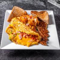 Western Omelette Platter · Serving plate of food. Beaten eggs that are folded over a filling.