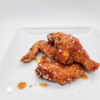9 Bone-In: Choose up to 2 Flavors · Crispy chicken wings deep fried in our special batter and tossed in sauce or dry rub of choi...