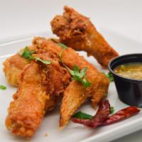24 Bone In: Choose up to 4 Flavors · Crispy chicken wings deep fried in our special batter and tossed in sauce or dry rub of choi...