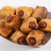 Pigs in a Blanket · Minature Franks wrapped in a tasty pastry. 8 in a basket.